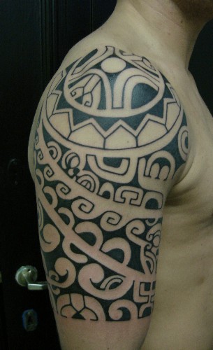 tribal tattoos for men shoulder and arm. Shoulder Maori Tribal Tattoos