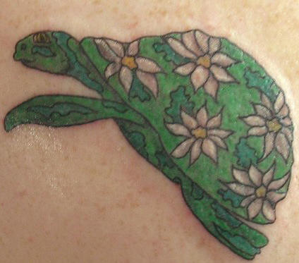 Hawaiian tattoos with meaning: “Try to be like the turtle — at ease in your 