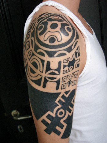 The Samoan tribal tattoo was done with a carved boar tusk, sharpened with a